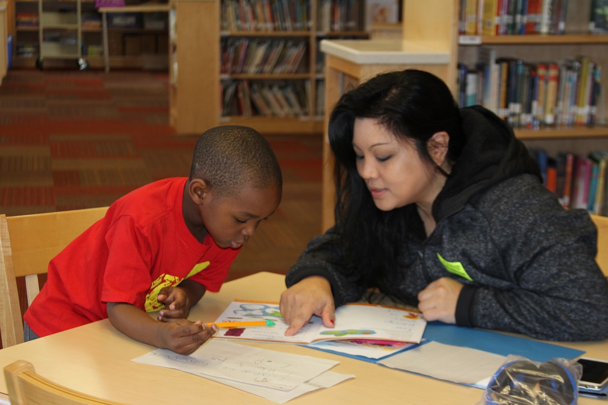 New Life Church member and child at LEC's College Park Elementary program